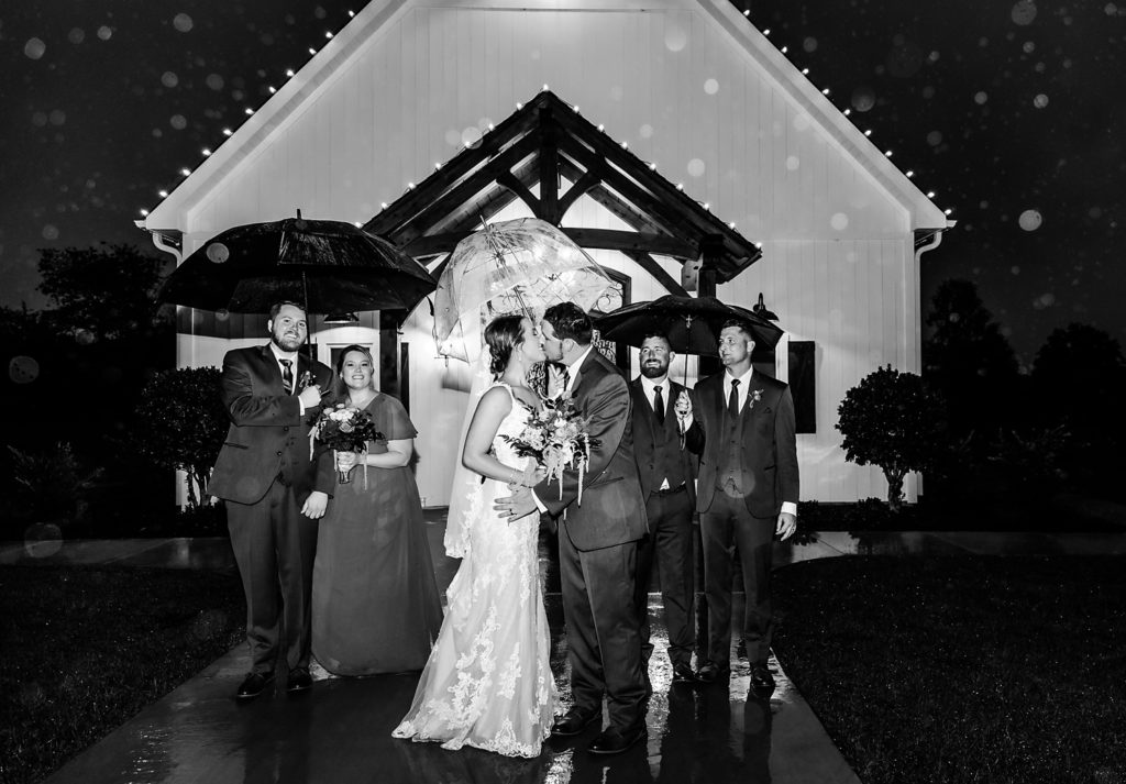 North Carolina Wedding Venue | Chickadee Hill Farms | Wedding Couple Rain Kiss