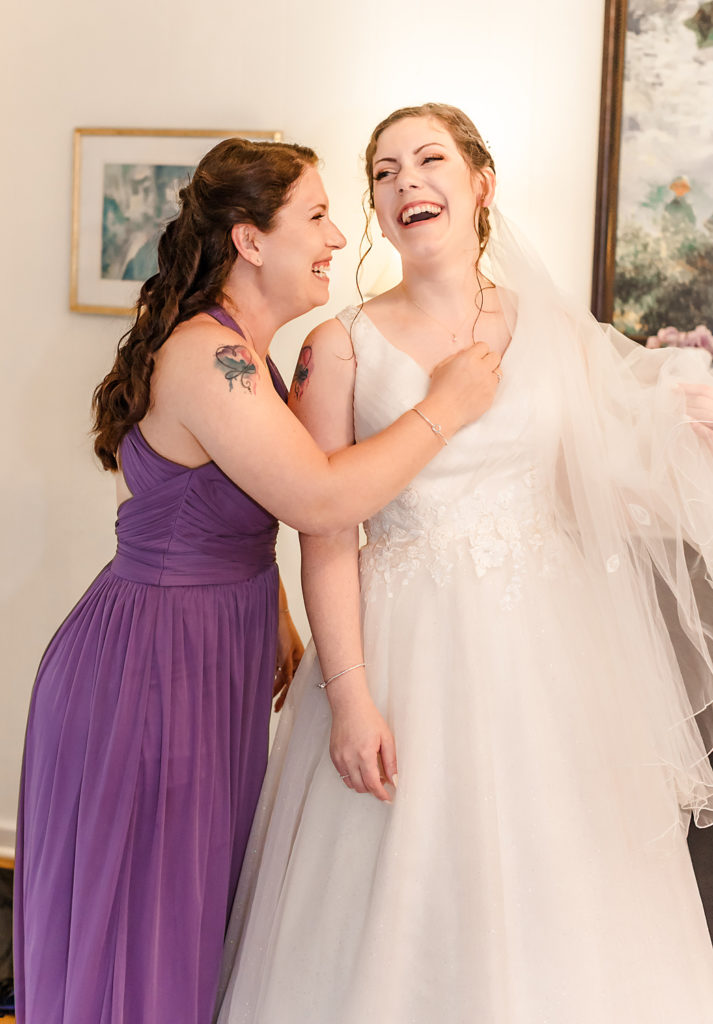 Bride laughing | Maid of Honor laughing| Camellia Gardens Wedding Venue